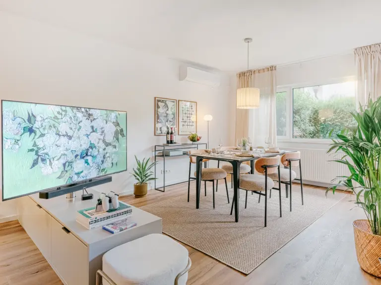 Dining room with elegant table and swivel Smart TV at Stay Eden TOPAZ GREEN near Ramstein Air Base.